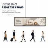 Ceiling-hung strip LED display showing retail advertising above shoppers without using floor space