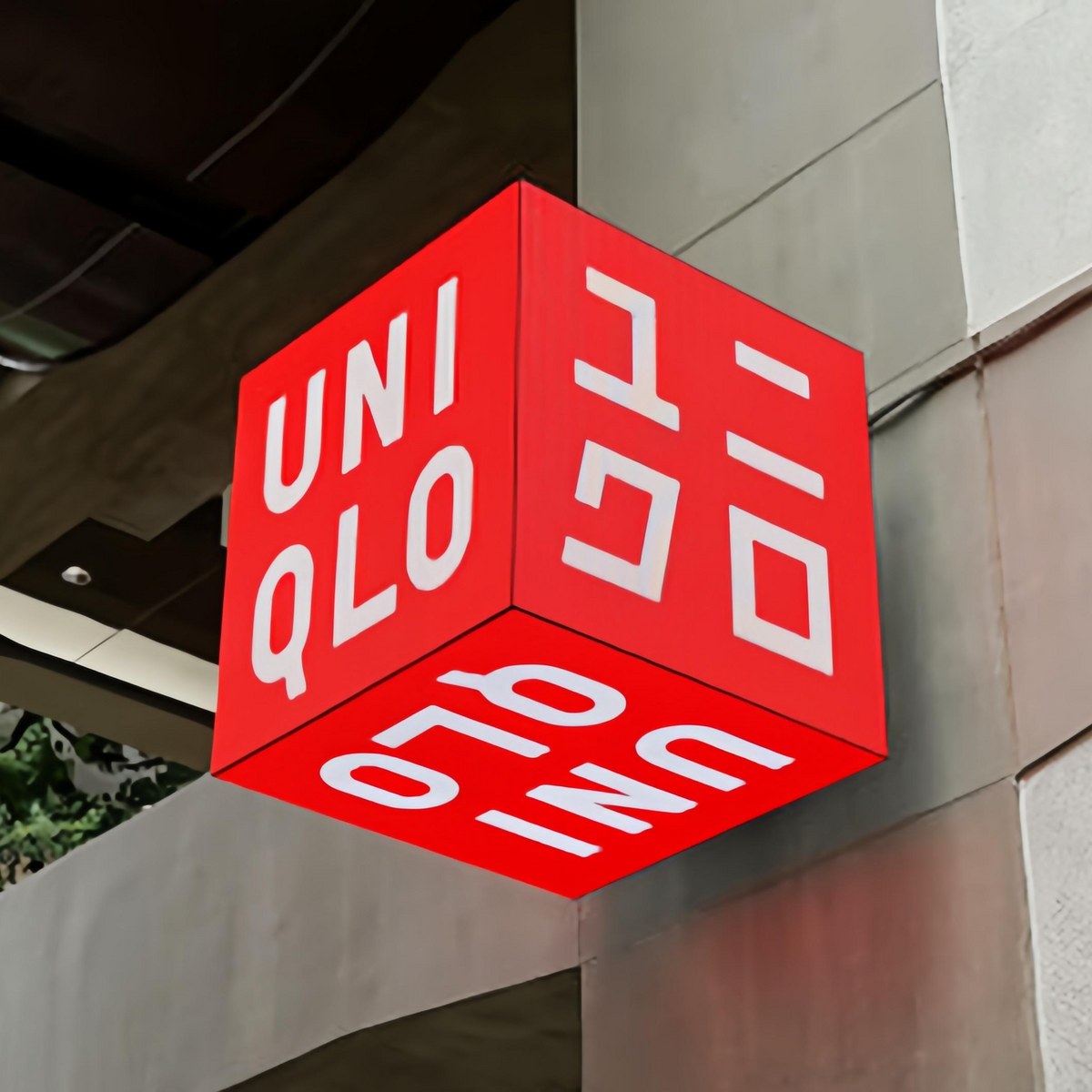 Architectural cube display installed beneath a building awning
